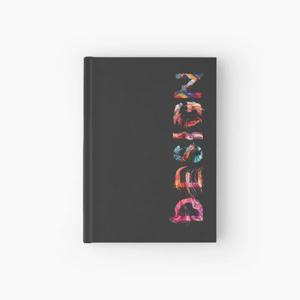 A hardcover journal with the word "Design" in paint.