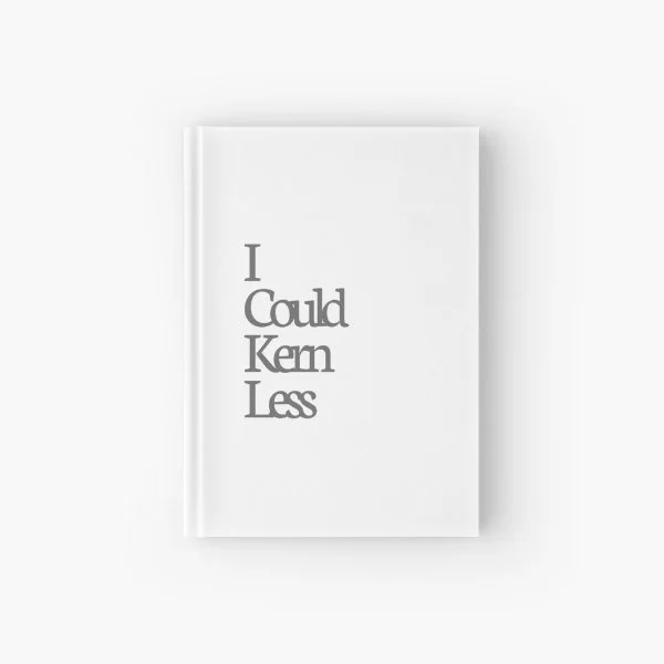 A hardcover journal with the phrase "I could kern less".