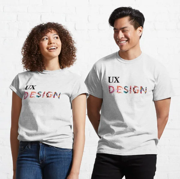 A woman and man wearing dark T-Shirts with the words "UX Design" painted on them.