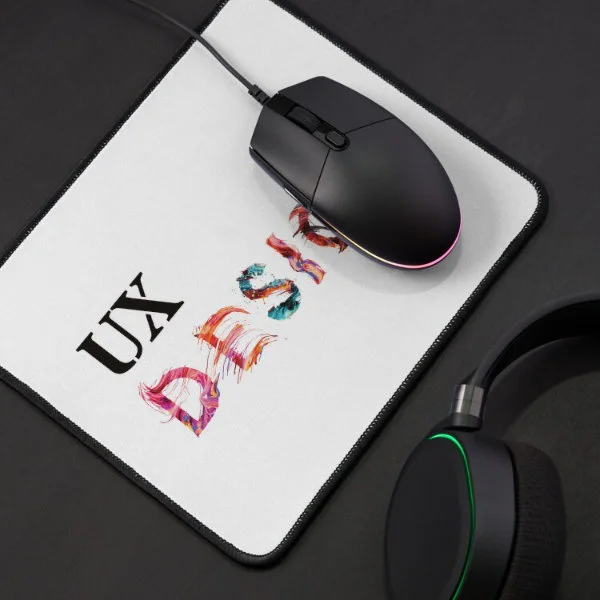 A mouse pad with the words "UX Design" in paint.