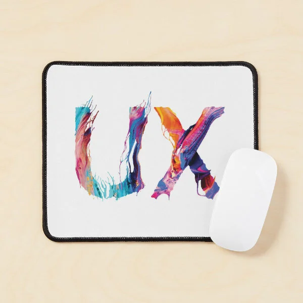 A mouse pad with the letters "UX" in paint.